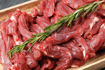 Poster - Raw sliced beef meat on wooden board