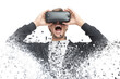 Shocked man in VR headset dissolving into pixels