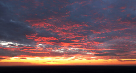 Wall Mural - only sky at sunset, abstract view with red and orange clouds