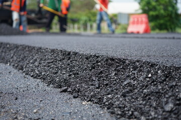 Wall Mural - The image is blurred in the construction of asphalt road.