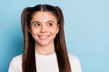 Poster - Photo of young lovely charming pretty little girl look copyspace dreaming smiling isolated on blue color background