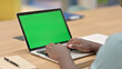 © stockbakers - African Man Typing on Laptop with Chroma Screen