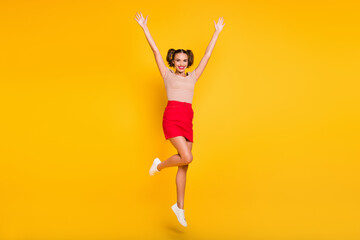 Sticker - Full length photo of girl jump raise hands wear striped t-shirt mini skirt footwear isolated yellow color background