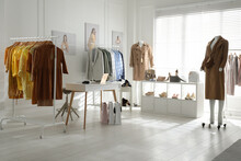 Collection Of Stylish Women's Clothes, Shoes And Accessories In Modern Boutique