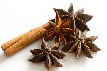Wall Mural - Dried Herbs and Spices: Cinnamon sticks and star anise isolated on white background.
