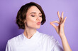 © deagreez - Photo of charming happy young woman make gesture chef kiss tasty meal isolated on violet color background