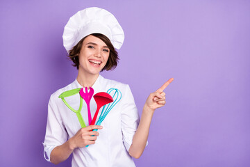 Sticker - Portrait of beautiful trendy cheerful chef showing ad copy space laughing isolated over bright violet purple color background