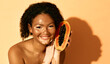 Papaya cosmetics for depigmentation of a woman's skin face with vitiligo. Skin care with features, beige background