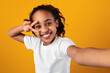 © Prostock-studio - Black girl taking a self portrait, point of view