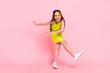 Canvas Print - Full length photo of adorable pretty schoolgirl dressed yellow outfit dark glasses dancing smiling isolated pink color background