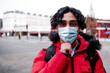 © Angel Santana Garcia/Westend61 - Young man in padded jacket wearing protective face mask during COVID-19