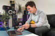 © Boy/Westend61 - Smiling businessman with credit card shopping over laptop while sitting at home