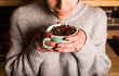 © David Ag√ºero Mu√±oz/Westend61 - Young woman smelling fresh coffee beans in cup at cafe