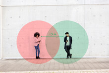 Two Overlapping Circles Visualizing Social Distancing Covering Man And Woman Standing Outdoors With Smart Phones In Hands
