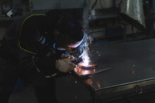 Young Welder Working With Welding Torch At Workshop