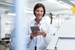 © Joseffson/Westend61 - Smiling female scientist with digital tablet at laboratory