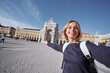 Traveling by Portugal. Young traveling woman taking selfie at famous square in Lisbon.