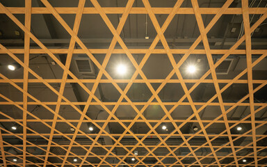 Poster - Wooden ceiling bottom view with lighting design of shopping department store ,shape wood modern design platform elements building architecture.
