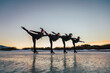 © CSSHOT/Westend61 - Female figure skaters practicing on frozen lake at dusk