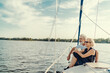 © luengo_ua - Romantic vacation and luxury travel. Senior loving couple sitting on the yacht deck. Sailing the river.