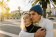 © Xavier Lorenzo/Westend61 - Affectionate young couple with arm around looking away