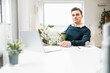 © Uwe Umst√§tter/Westend61 - Businessman with disposable coffee cup sitting at home office