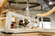 © Valentina Barreto/Westend61 - Craftsmen working at table saw in industry