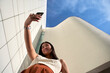 © Veam/Westend61 - Young woman taking selfie with mobile phone on sunny day