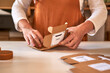 © Veam/Westend61 - Woman packing handmade soap in boxes at workshop