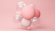 © George J/Westend61 - Three dimensional render of pastel colored bubbles floating against pink background