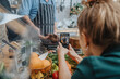 © Mareen Fischinger/Westend61 - Young woman photographing chef cooking tomahawk steak in frying pan while standing in kitchen