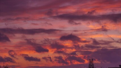 Aufkleber - Colorful red clouds in sunset sky background. Timelapse