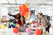 © peter scholl/Westend61 - Cheerful businesswoman taking selfie with colleagues while during birthday celebration in office