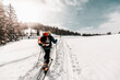 © Daniel Waschnig Photography/Westend61 - Active senior man skiing on snow covered land during vacation
