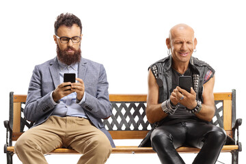 Canvas Print - Man and a punk sitting on a bench and typing on mobile phones