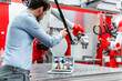 © Daniel Ingold/Westend61 - Young male automation engineer gesturing while discussing with colleagues during video call through laptop in factory