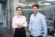 © Florian K√ºttler/Westend61 - Male and female entrepreneurs standing in office