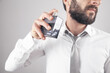 © andranik123 - Caucasian elegant man spraying perfume.