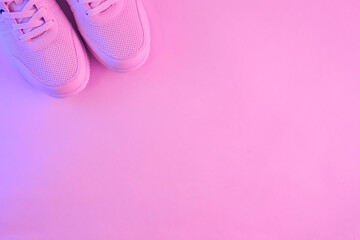 Wall Mural - Fashion white sneakers in neon light. Sport shoes for training in the gym. Creative minimalism. 90s concept.