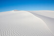 © Tandem Stock - A white sand dune's curved ridge