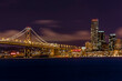 © Tandem Stock - Night shot of the downtown San Francisco skyline and the end of the Bay Bridge.