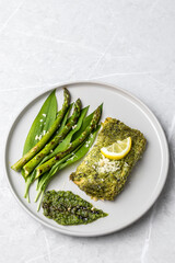 Wall Mural - Salmon fillet with green wild garlic pesto. Green asparagus with salmon