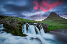 Colorful Skies Over Stunning Waterfalls In Iceland.