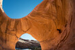 © Tandem Stock - Ancient Anasazi ruins inside a natural arch on the Navajo reservation in Monument Valley.