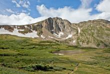Lone Backpacker Descends The Trail To Devil's Thumb Lake In The Indian Peaks Wilderness, Colorado