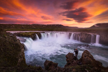 Colorful Skies Over Stunning Waterfalls In Iceland.