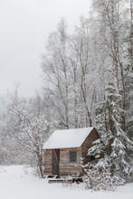 Small Wood Cabin In Winter On A Farm In Chugiak, Alaska.