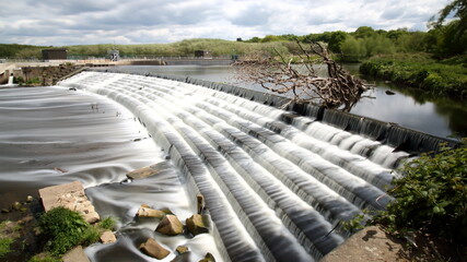 Long 30 second exposure of a weir on the river Calder in Wakefield England