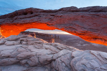 The Rising Sun Sets Mesa Arch Aglow In Canyonlands National Park.