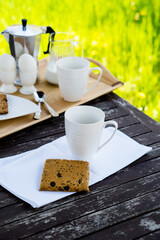 Wall Mural - Breakfast for two on an old table in the summer garden